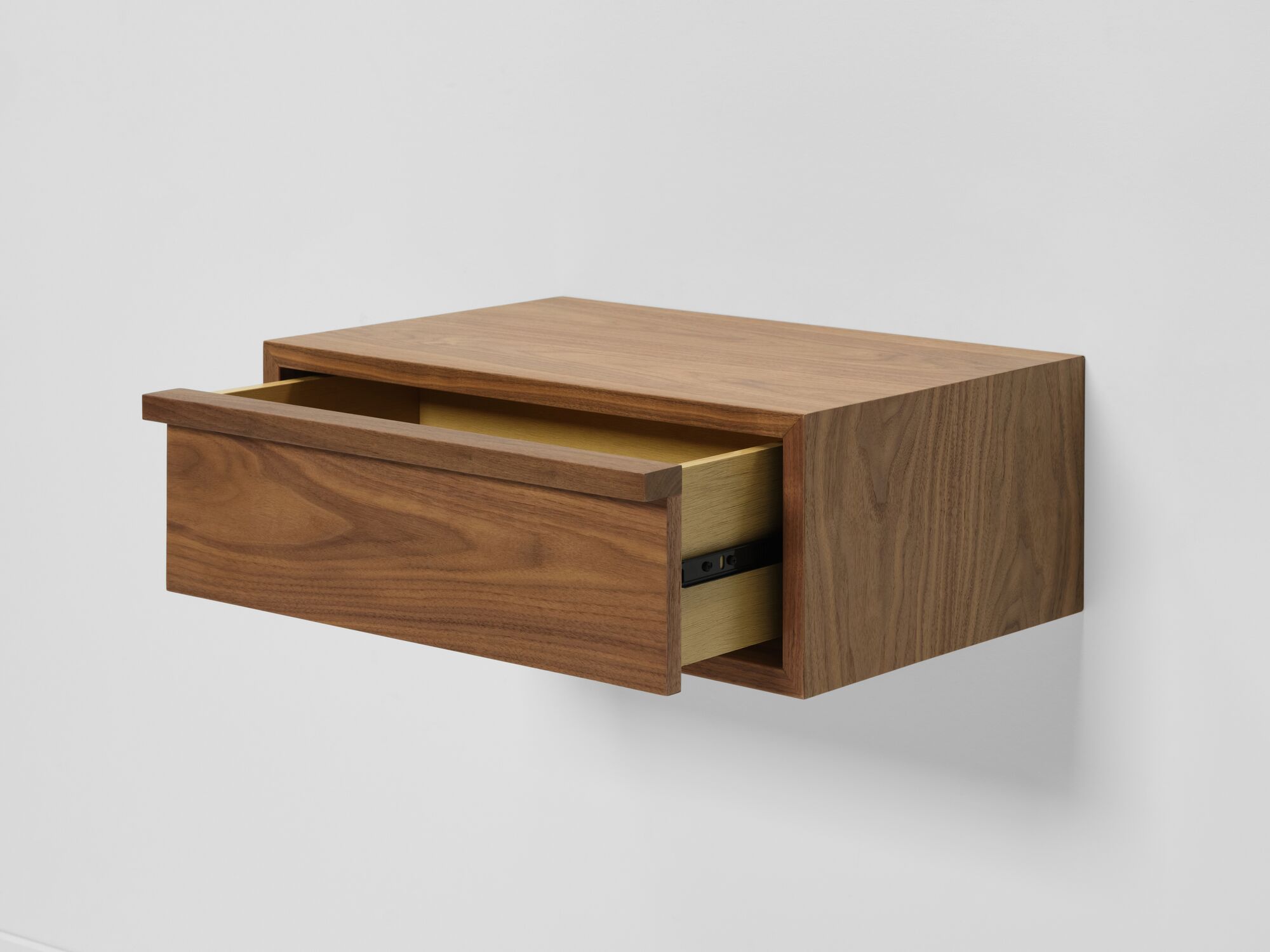 Modern walnut floating nightstand with drawer open detail view